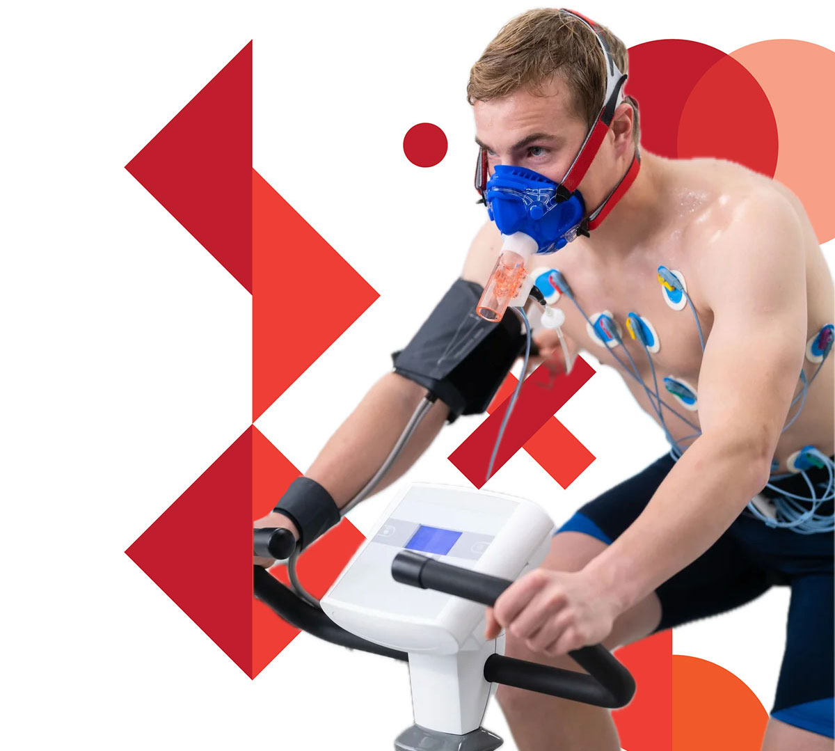 man on an exercise bike and connected to medical monitoring equipment